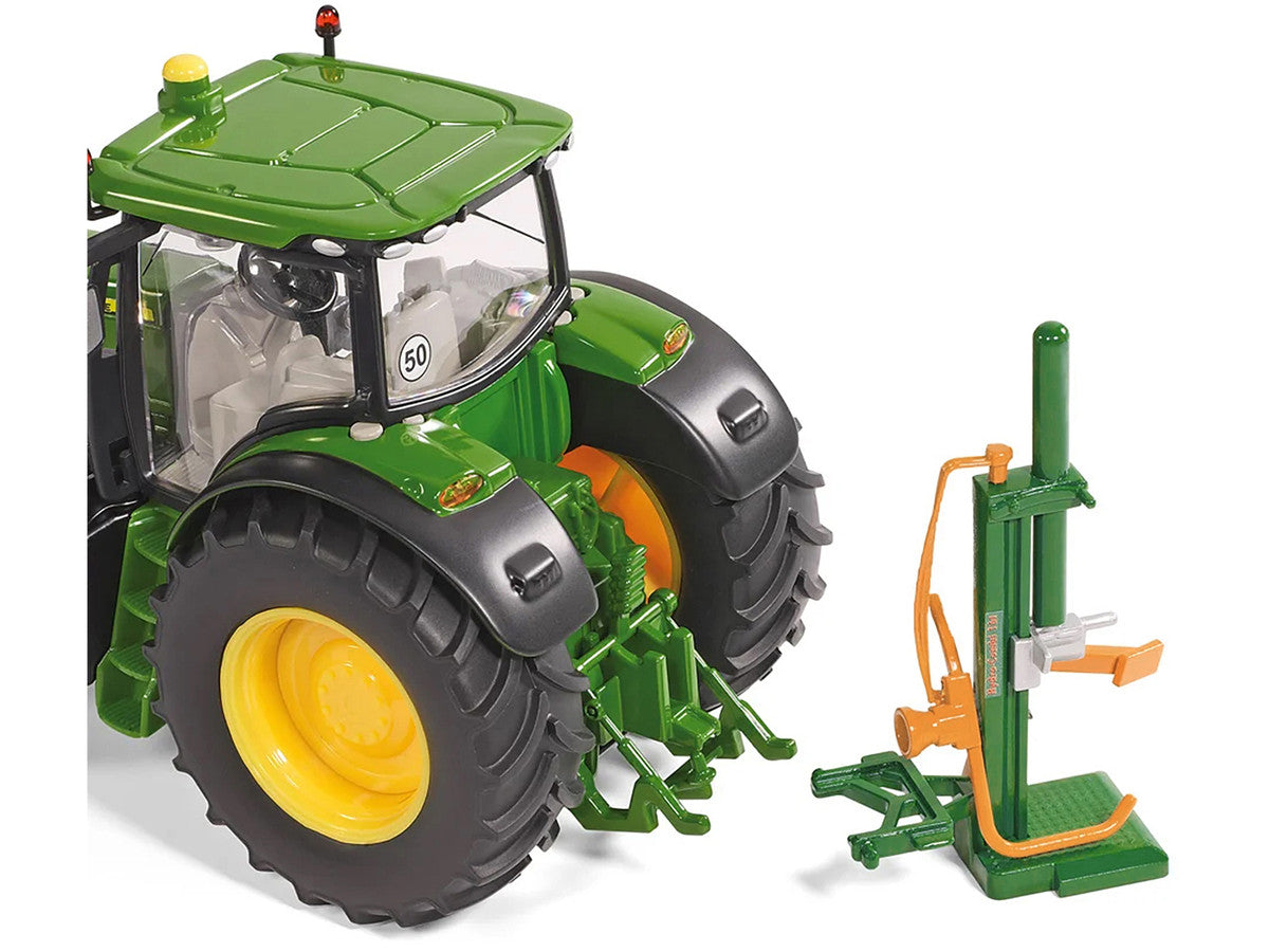 A green diecast scale model of a log splitter with a green tractor