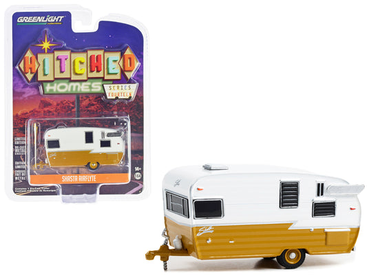 Brand new 1/64 scale diecast model of Shasta Airflyte Travel Trailer Butterscotch and White "Hitched Homes" Series 14 di