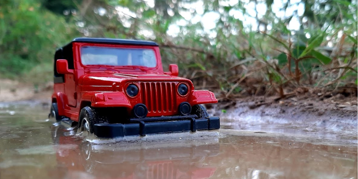 A classic 1990's red Jeep Wrangler diecast scale model car